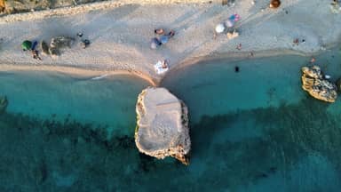 Aerial view of a beach and turquoise sea on the Albanian coast
