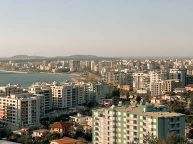 Aerial view of apartment blocks and the bay in Vlorë, a base for remote workers on the Albanian coast