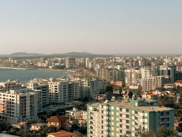 Aerial view of apartment blocks and the bay in Vlorë, a base for remote workers on the Albanian coast